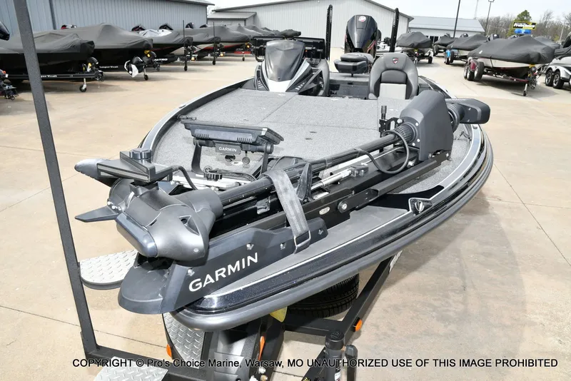 Slide: The Image of 2025 Triton 21XP boat with Garmin equipment on a parking lot. - 30