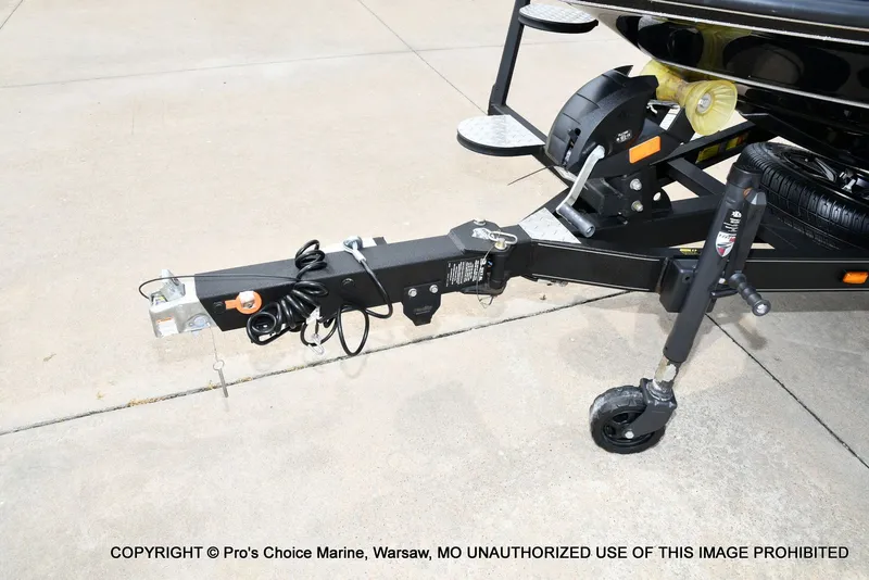 Slide: The Image of Triton 21XP 2025 boat trailer on concrete surface. - 31
