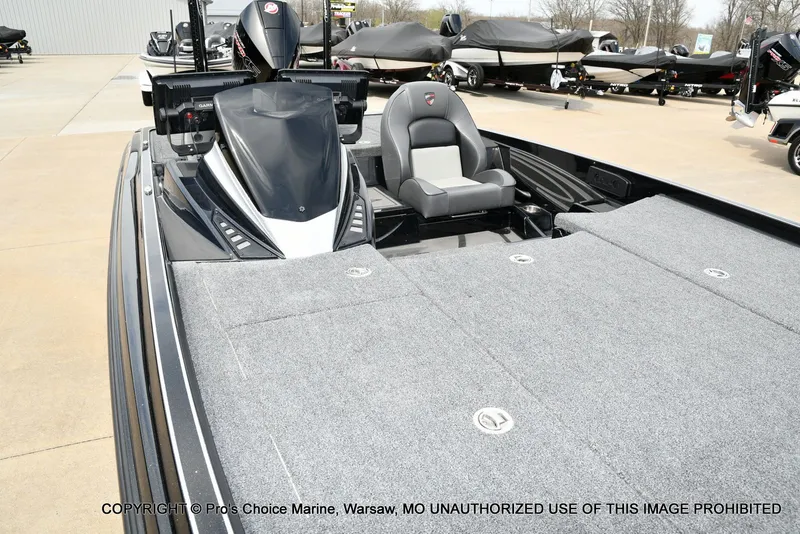Slide: The Image of 2025 Triton 21XP boat with gray deck and seat. - 36