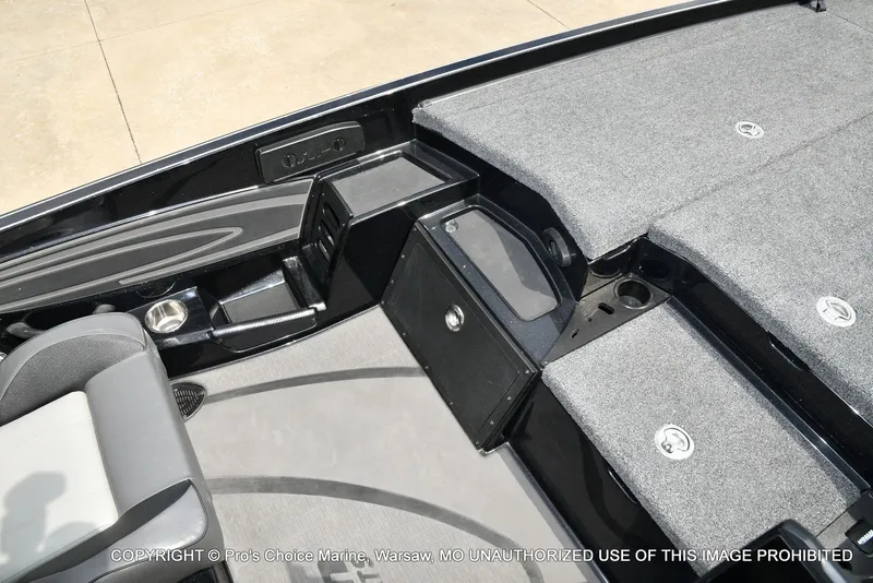 Slide: The Image of Interior of 2025 Triton 21XP with gray upholstery and storage compartments. - 48