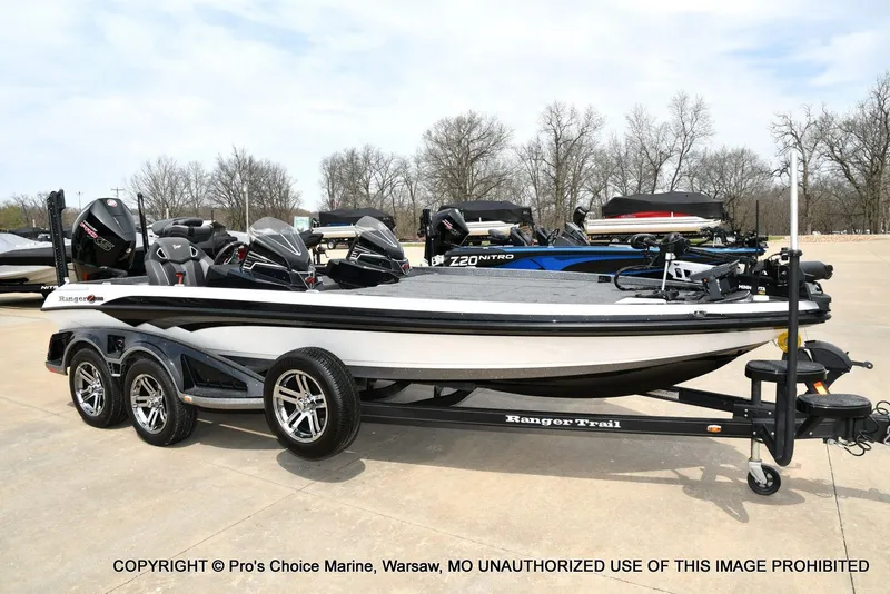 The Image of 2023 Ranger Z521R Cup boat on trailer parked outdoors. - 1