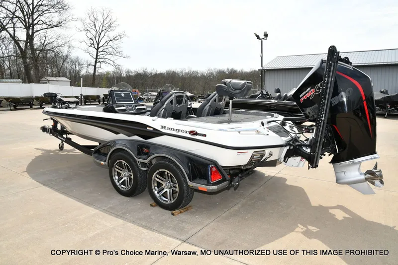 Slide: The Image of 2023 Ranger Z521R Cup boat with 300 Pro-XS engine on parking lot. - 28
