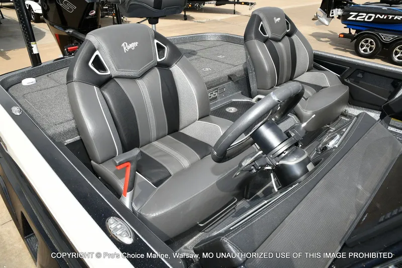 Slide: The Image of Interior of a 2023 Ranger Z521R Cup boat with steering wheel. - 40