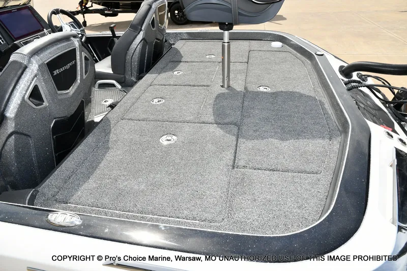 Slide: The Image of 2023 Ranger Z521R Cup boat interior with gray carpet flooring. - 45