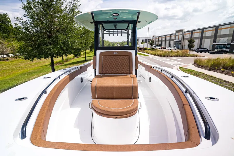 Slide: The Image of 2026 Sea Hunt ULTRA 285CB boat with brown seating and modern design. - 22