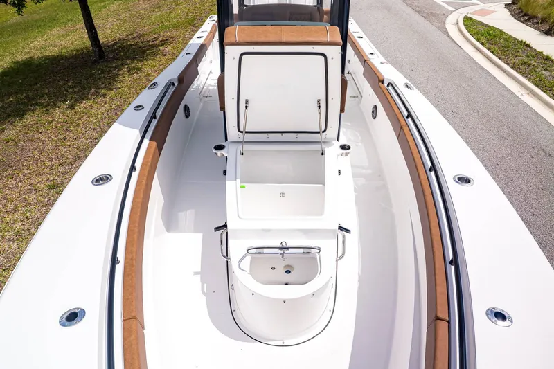 Slide: The Image of Sea Hunt ULTRA 285CB 2026 with open storage and seating area. - 23