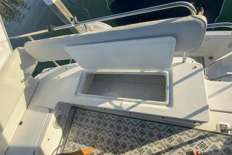 Slide: The Image of 2002 Bayliner 3988 Command Bridge Motoryacht open storage compartment on deck. - 10