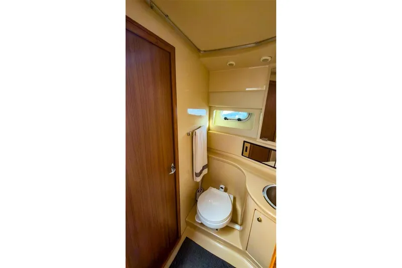 Slide: The Image of Bathroom interior of 2002 Bayliner 3988 Command Bridge Motoryacht, featuring toilet and sink. - 29