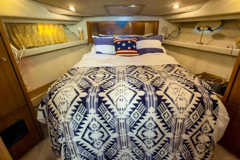 Slide: The Image of Cozy bedroom in 2002 Bayliner 3988 Command Bridge Motoryacht with patterned bedding. - 30