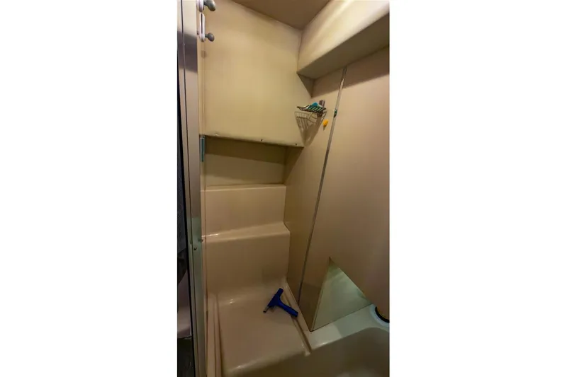 Slide: The Image of Shower area in 2002 Bayliner 3988 Command Bridge Motoryacht, featuring beige interior. - 32