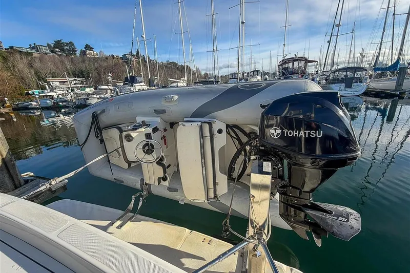 Slide: The Image of 2002 Bayliner 3988 Command Bridge Motoryacht with Tohatsu outboard motor at marina. - 35