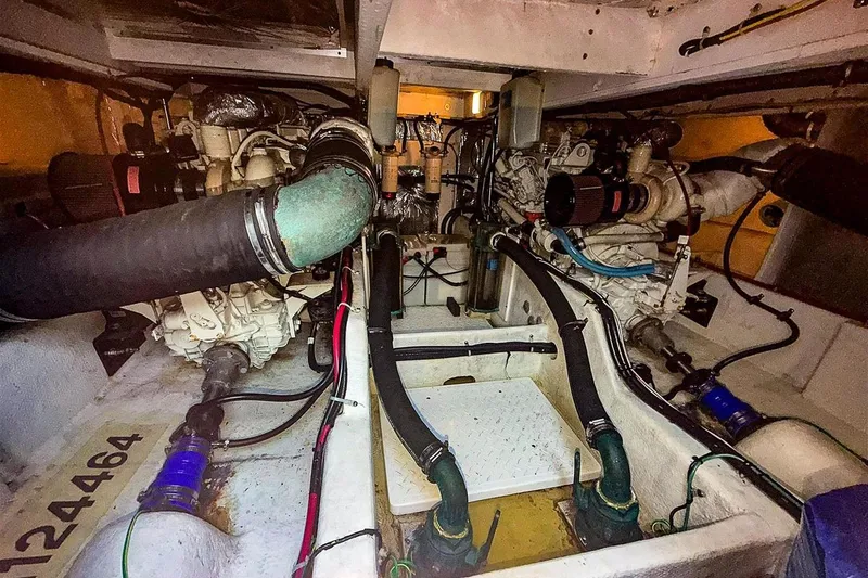 Slide: The Image of Engine room of 2002 Bayliner 3988 Command Bridge Motoryacht, showcasing dual engines and components. - 37