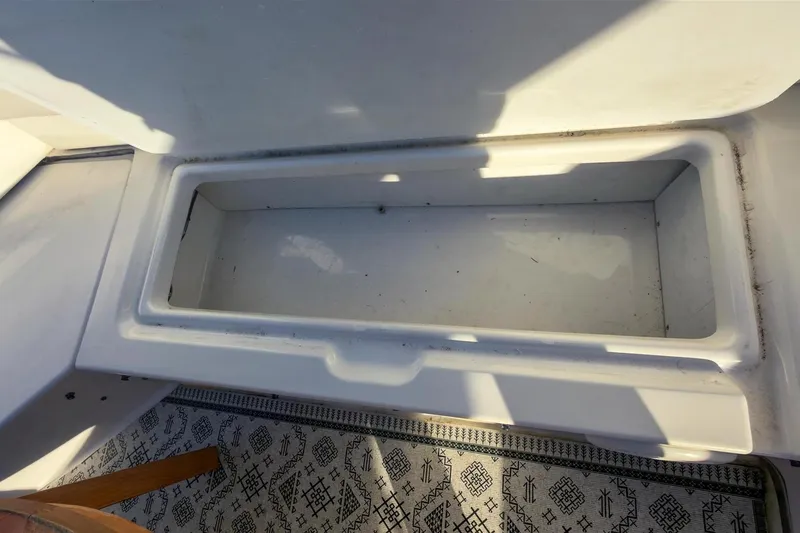 Slide: The Image of Open storage compartment on 2002 Bayliner 3988 Command Bridge Motoryacht, with patterned flooring. - 9