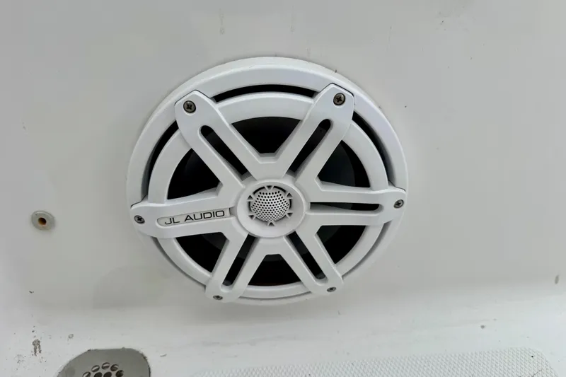 Slide: The Image of JL Audio speaker on 2016 Sea Hunt Ultra 234 boat, white grille design. - 15