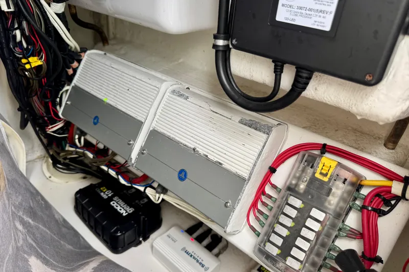 Slide: The Image of Electrical components and wiring inside a 2016 Sea Hunt Ultra 234 boat. - 16