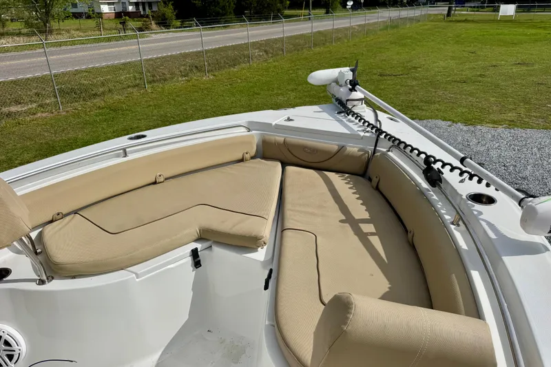 Slide: The Image of 2016 Sea Hunt Ultra 234 boat with beige seating and trolling motor. - 4
