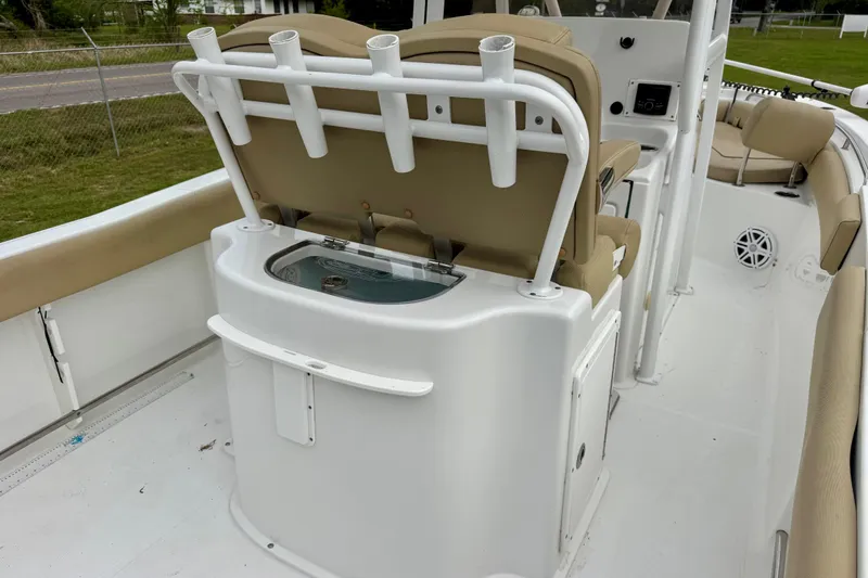 Slide: The Image of 2016 Sea Hunt Ultra 234 boat interior with seating and rod holders. - 8