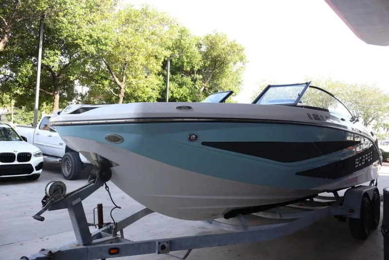 The Image of 2023 Scarab 255 ID boat on trailer parked outdoors. - 0