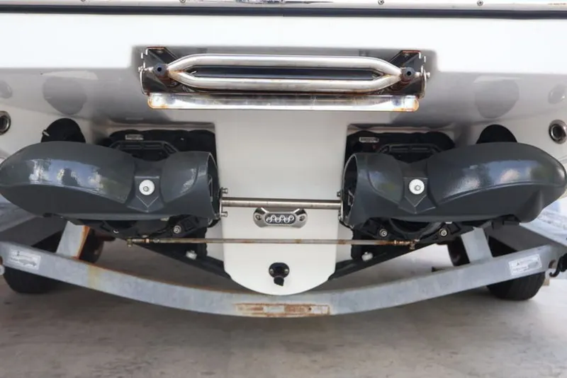 Slide: The Image of Rear view of 2023 Scarab 255 ID boat with dual engines. - 3