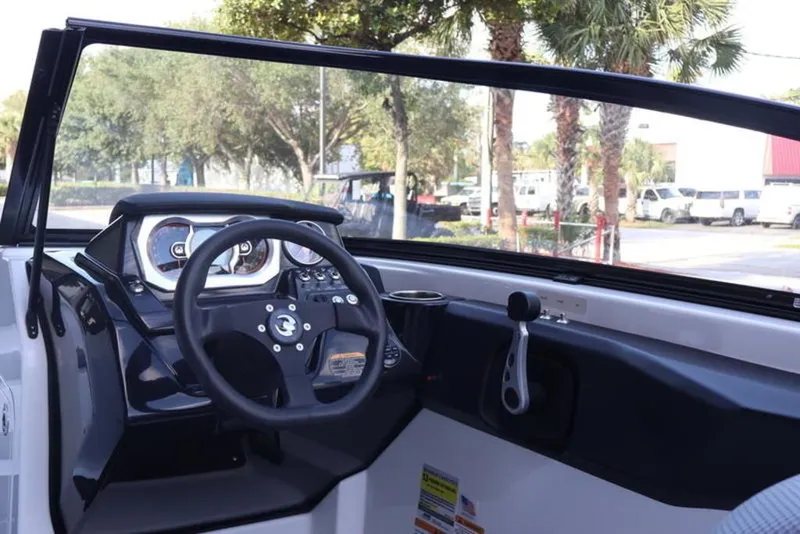 Slide: The Image of Interior view of 2023 Scarab 255 ID boat with steering console. - 6