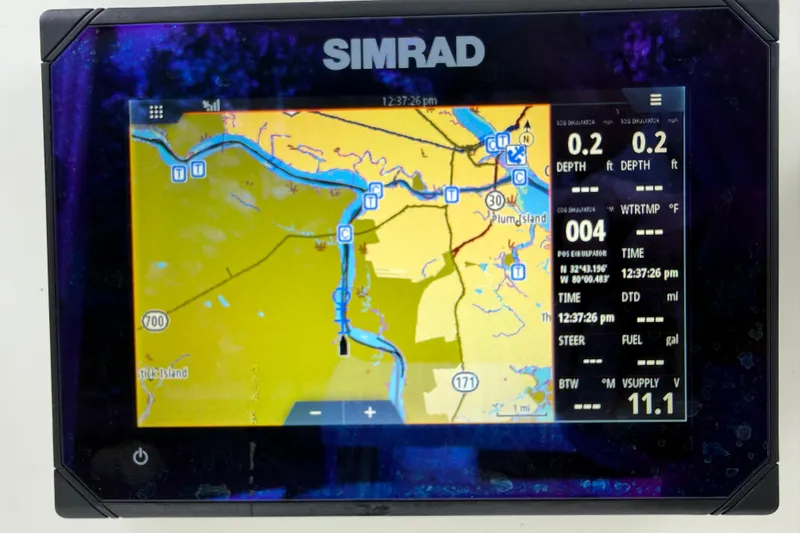 Slide: The Image of Simrad GPS display on a 1997 Regulator 23 boat, showing navigation map and data. - 12