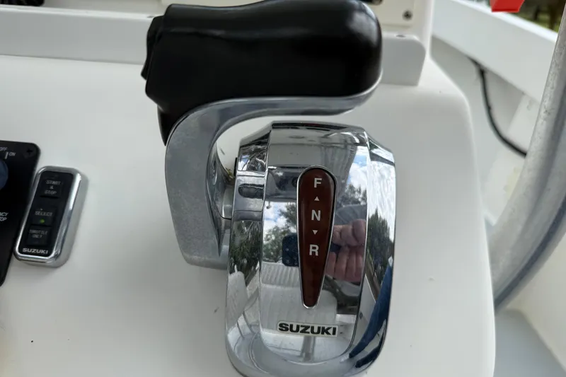 Slide: The Image of Suzuki boat throttle control on a 1997 Regulator 23 console. - 14