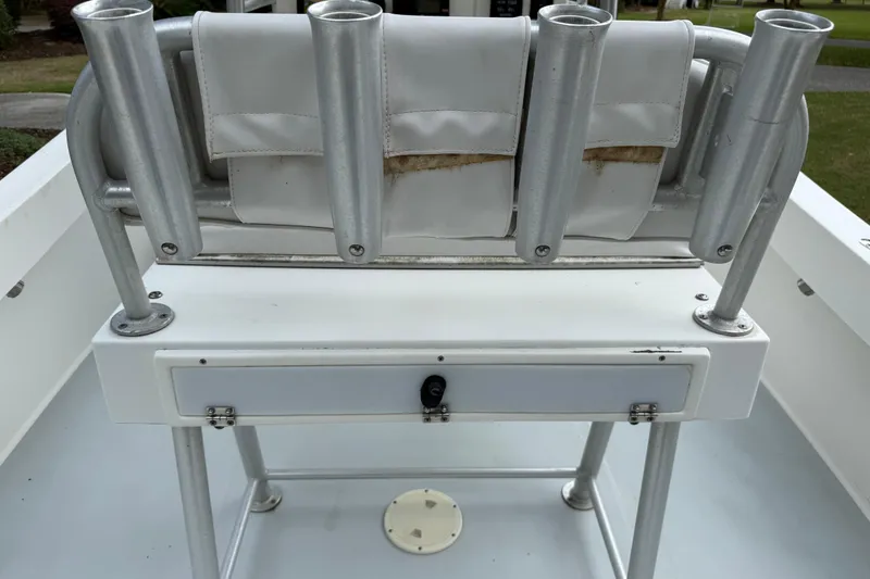 Slide: The Image of 1997 Regulator 23 boat with rod holders and storage compartment. - 16