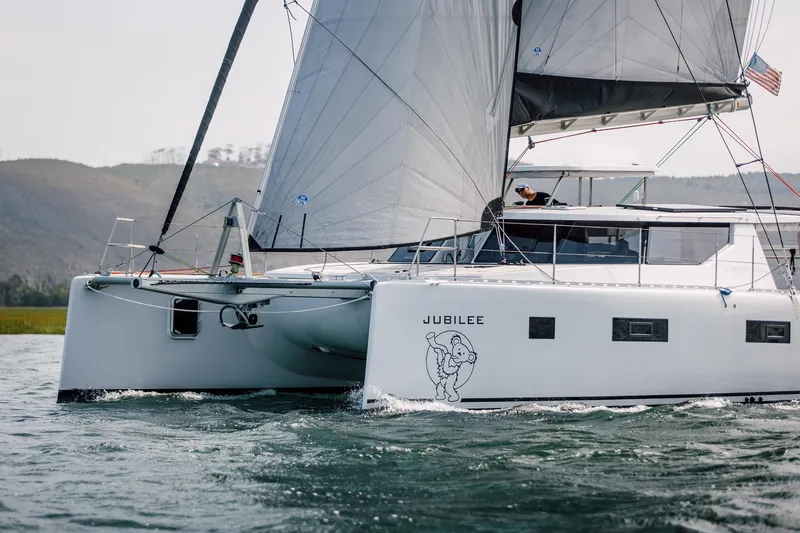 Slide: The Image of Sailing catamaran Vision 444, 2026 model, named Jubilee, cruising on open water. - 4