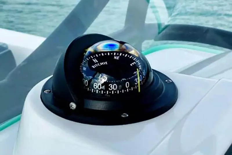 Slide: The Image of Compass on 2026 Twin Vee 240 GFX DC boat dashboard, close-up view. - 11