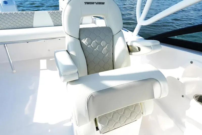 Slide: The Image of Manufacturer Provided Image: Luxurious seating on 2026 Twin Vee 240 GFX DC boat with hexagonal pattern design. - 12