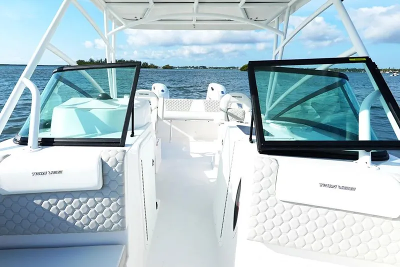 Slide: The Image of Manufacturer Provided Image: 2026 Twin Vee 240 GFX DC boat interior with open water view. - 16
