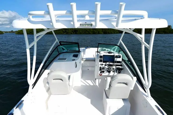 Slide: The Image of Manufacturer Provided Image: 2026 Twin Vee 240 GFX DC boat interior with dual consoles and open water view. - 2