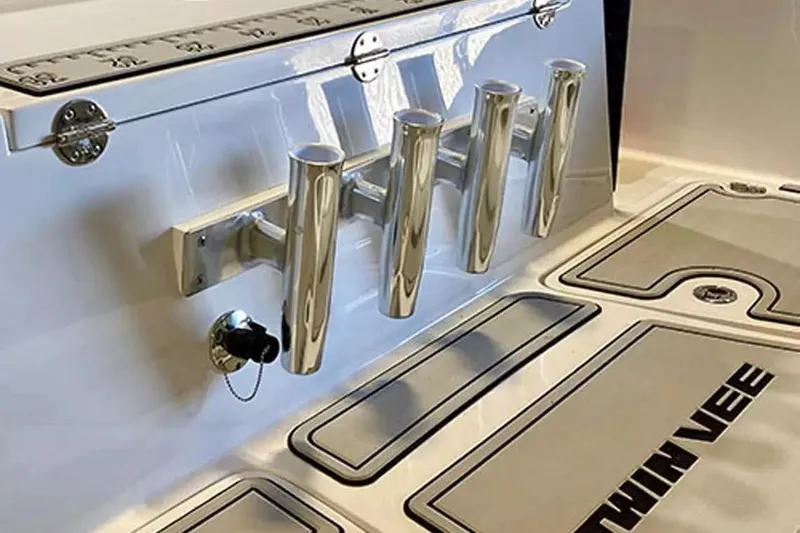 Slide: The Image of 2026 Twin Vee 240 GFX DC boat deck with rod holders and branded flooring. - 21