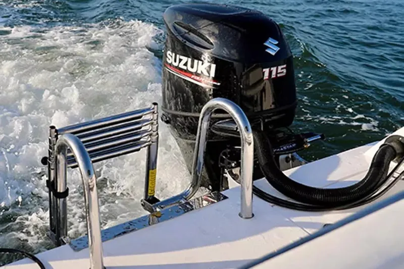 Slide: The Image of Outboard motor on 2026 Twin Vee 240 GFX DC boat in water. - 4