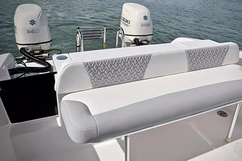 Slide: The Image of 2026 Twin Vee 240 GFX DC boat with dual Suzuki 140 engines on water. - 6