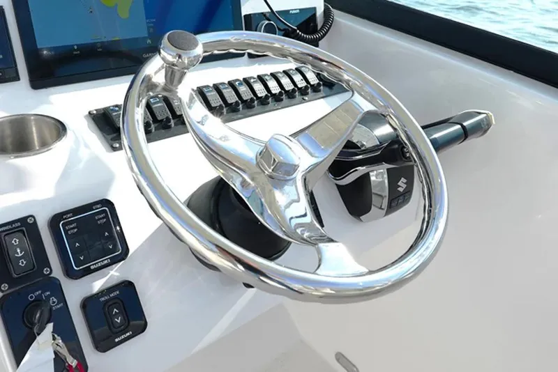 Slide: The Image of Manufacturer Provided Image: Steering wheel and controls of 2026 Twin Vee 240 GFX DC boat. - 9