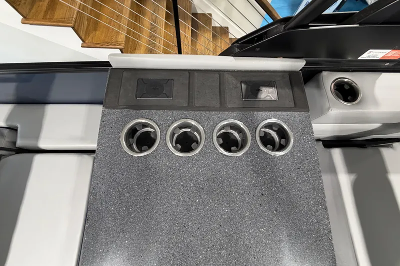 Slide: The Image of Interior of 2026 Godfrey Monaco 255 MTF boat with cup holders and control panel. - 9