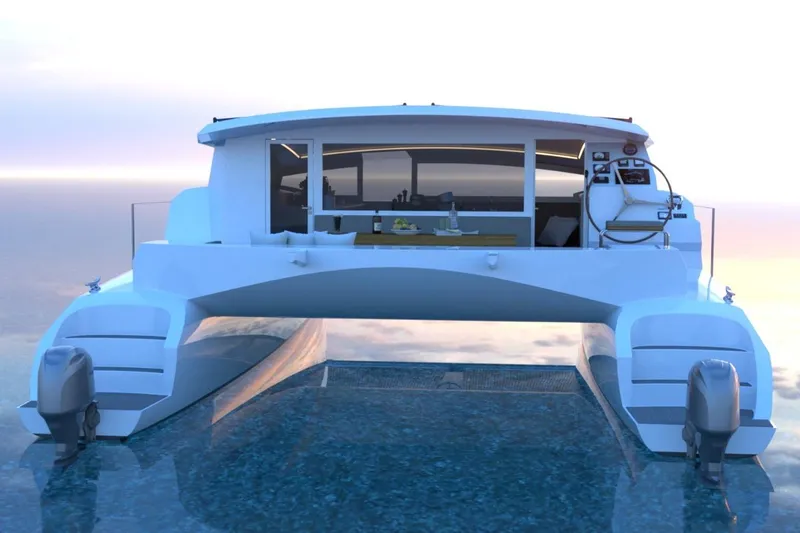 Slide: The Image of 2026 Catamaran Cruisers Power Cat on serene water at sunset. - 4