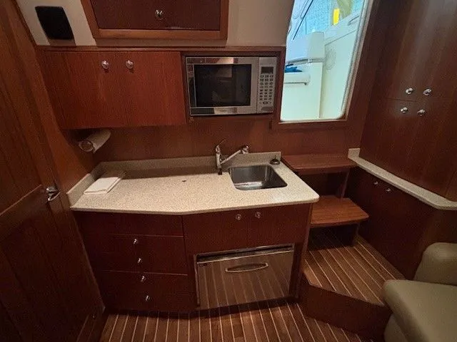 Slide: The Image of Galley of 2007 Albemarle 36 Express Fisherman with sink and microwave. - 12