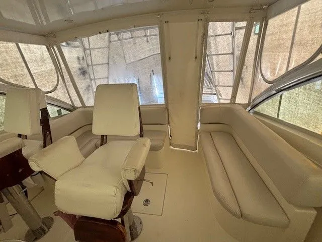 Slide: The Image of Interior of a 2007 Albemarle 36 Express Fisherman boat with beige seating. - 18