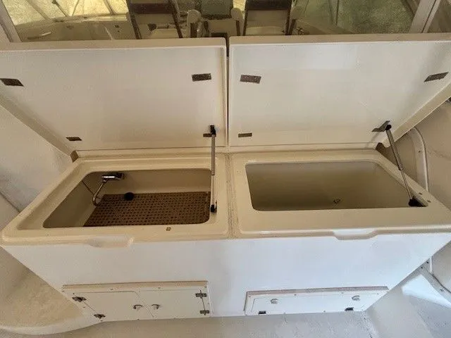 Slide: The Image of 2007 Albemarle 36 Express Fisherman, open storage compartments in cockpit. - 22