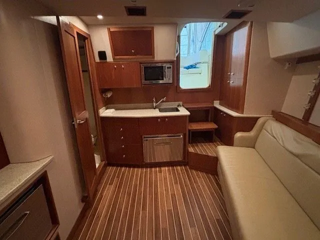 Slide: The Image of Interior of 2007 Albemarle 36 Express Fisherman with kitchen and sofa. - 7