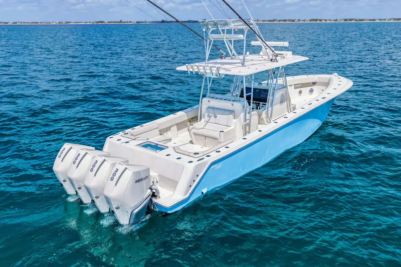 Slide: The Image of 2021 SeaVee 390B boat with triple Mercury engines on open ocean. - 10