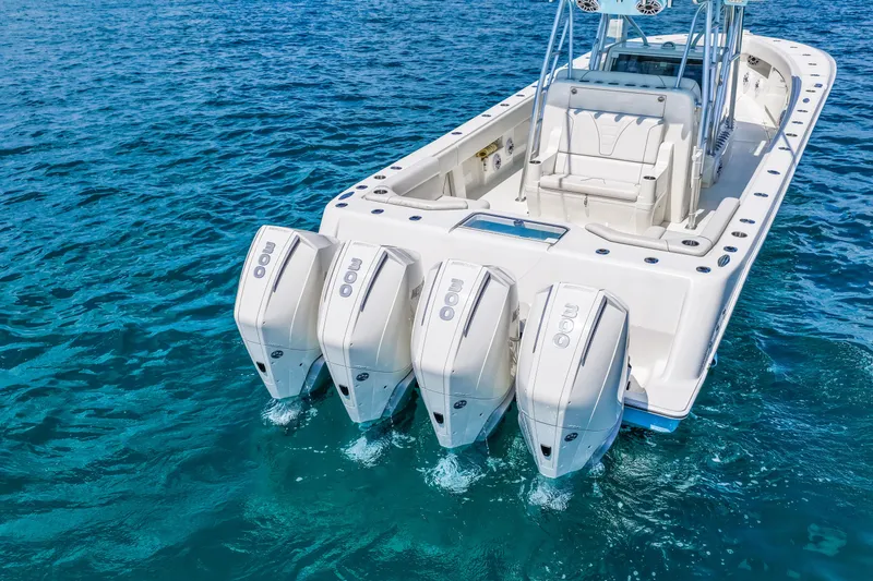 Slide: The Image of 2021 SeaVee 390B boat with quad engines on clear blue water. - 14