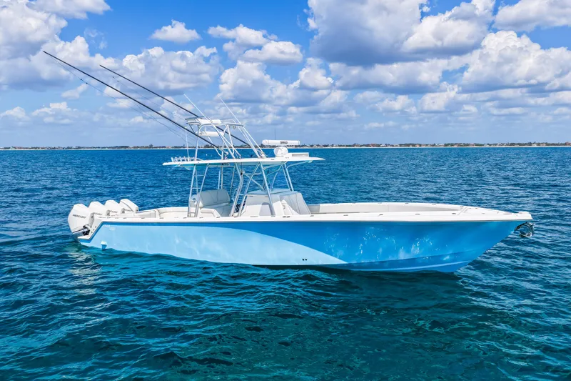 Slide: The Image of 2021 SeaVee 390B boat on open ocean under blue sky with clouds. - 15
