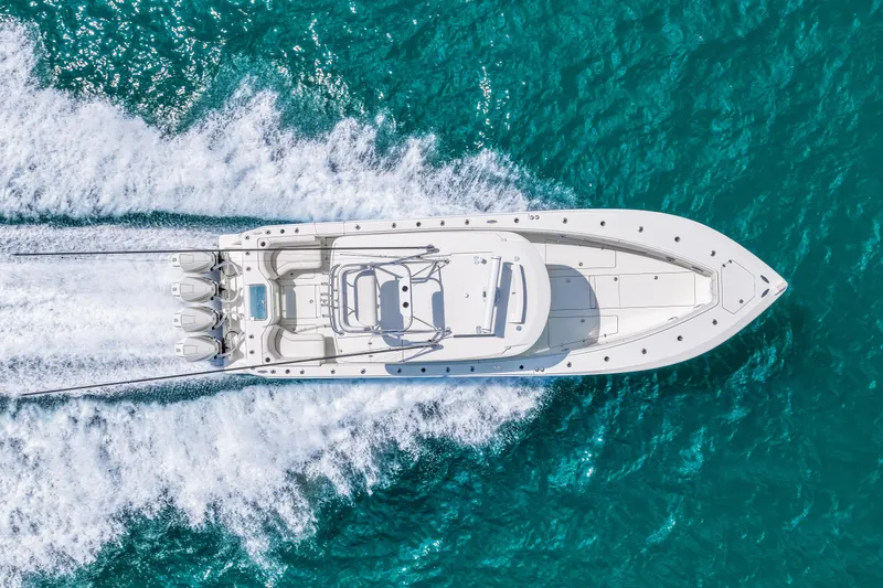Slide: The Image of Aerial view of 2021 SeaVee 390B boat cruising on turquoise water. - 17