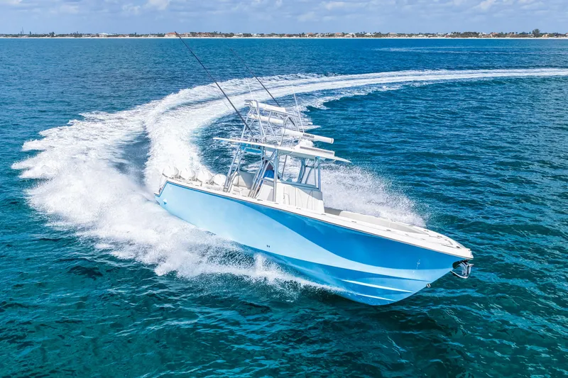 Slide: The Image of 2021 SeaVee 390B boat cruising on clear blue ocean waters. - 18