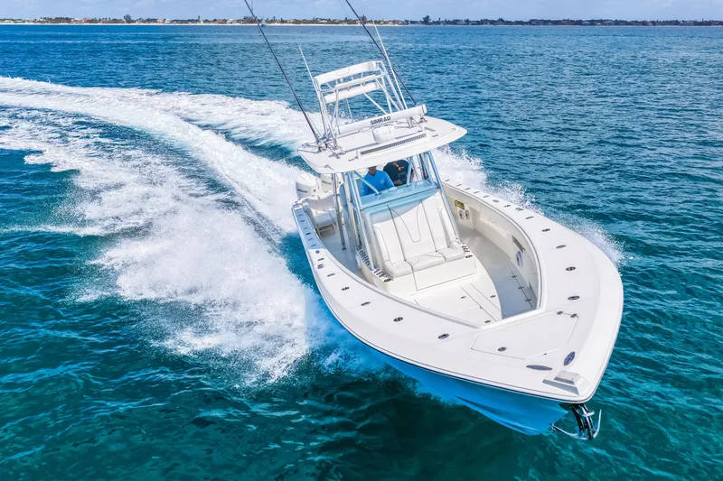 Slide: The Image of 2021 SeaVee 390B boat cruising on clear blue ocean waters. - 20