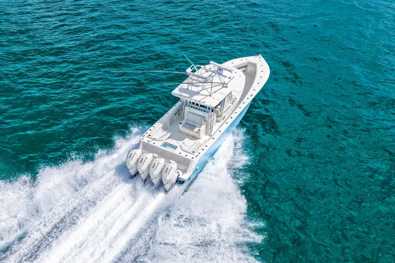Slide: The Image of 2021 SeaVee 390B boat cruising on clear blue ocean waters. - 27