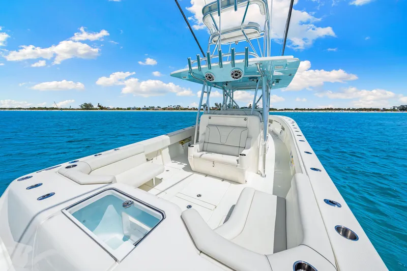 Slide: The Image of 2021 SeaVee 390B boat on clear blue water, featuring spacious seating and modern design. - 29